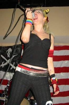 Tibbie X reinventing a mic embrace (Pic courtesy of the X-Possibles site)